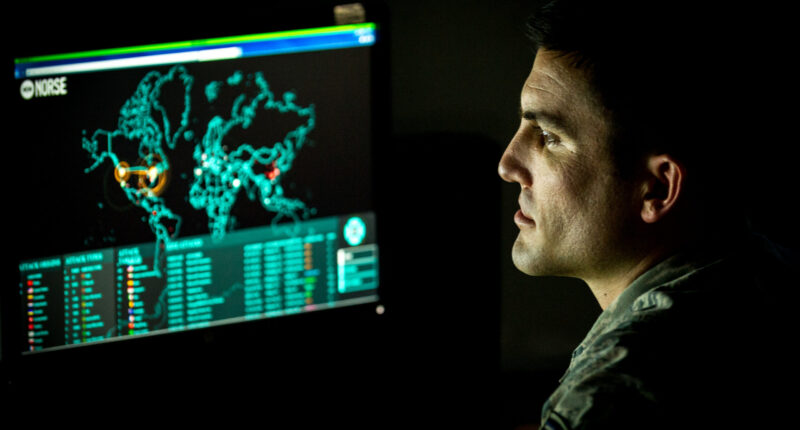 Cyber warfare operations journeyman assigned to the 175th Cyberspace Operations Group of the Maryland Air National Guard monitors live cyber attacks