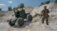 A Ukrainian soldier operates a Lyut 2.0 unmanned ground vehicle