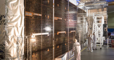 Lockheed Martin personnel assembling the fifth Mobile User Objective System (MUOS) satellite for the US Space Force