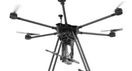 A drone equipped with the SMASH Dragon advanced robotic weapon