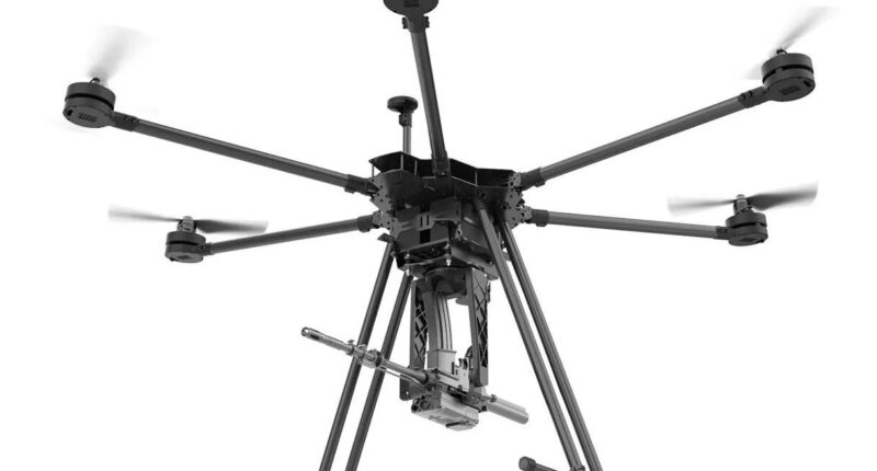 A drone equipped with the SMASH Dragon advanced robotic weapon