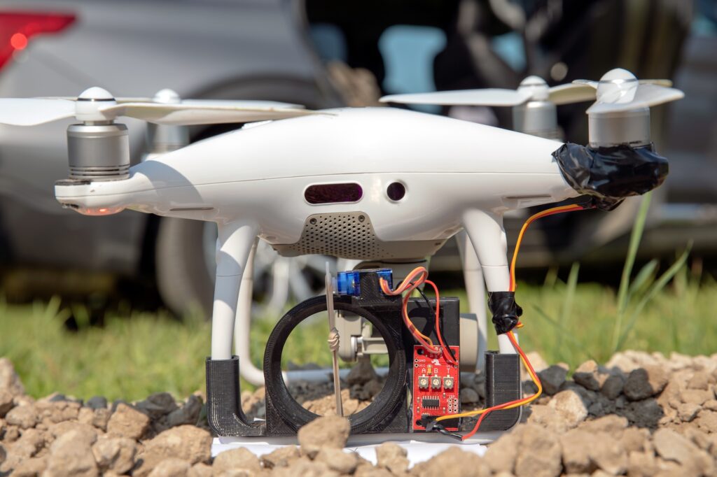 A small quadcopter drone lifts off to conduct a simulated convoy attack during a US Army exercise